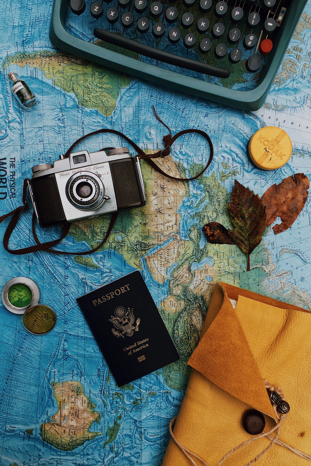 Passport, notebook and travel documents prepared for cruise planning